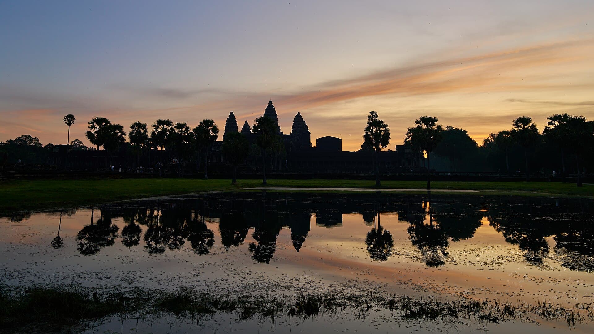 Angkor Wat at dawn, reflected in the pond