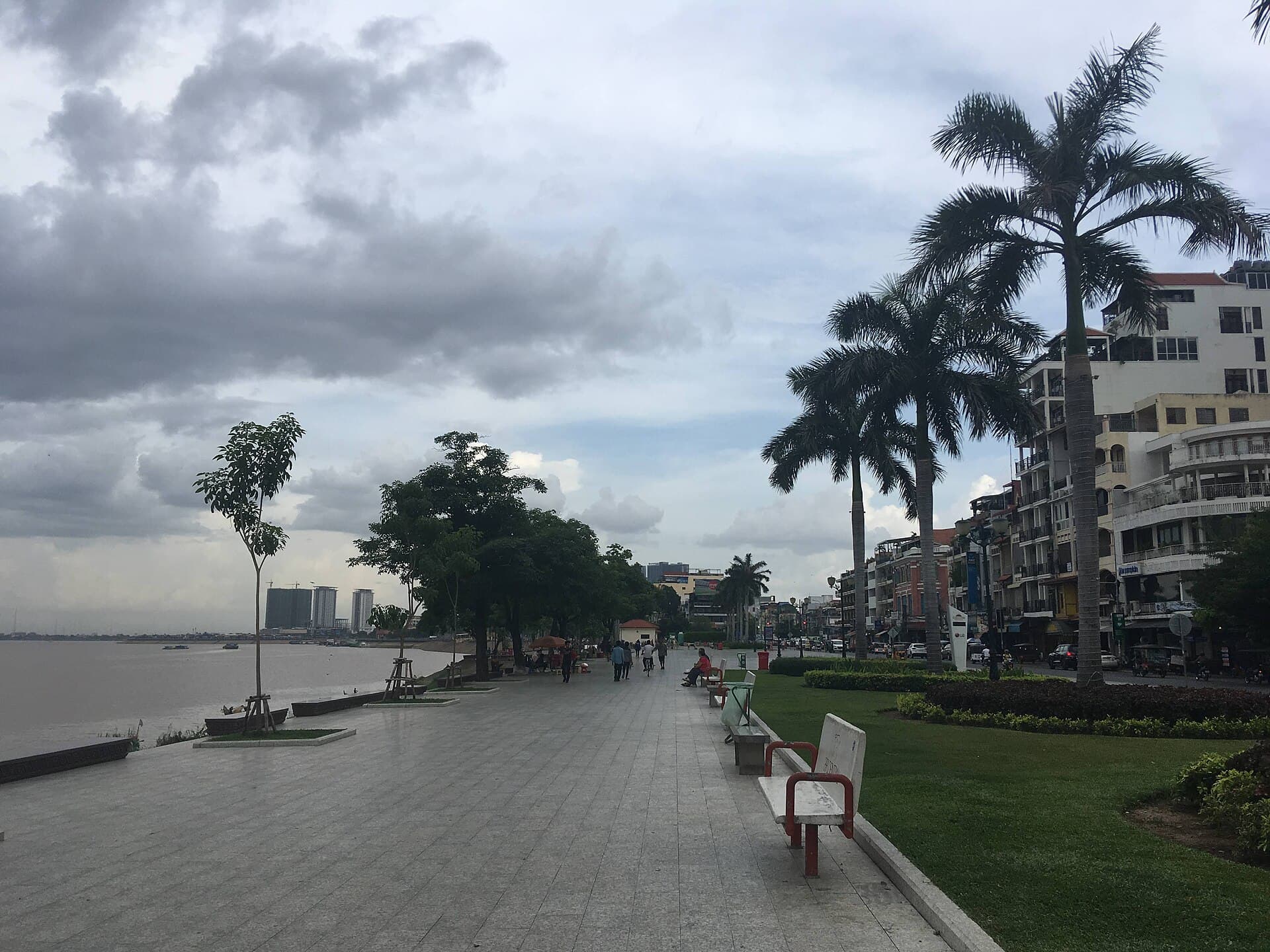 Riverside Park on the Tonle Sap River in Phnom Penh, with benches and palm trees