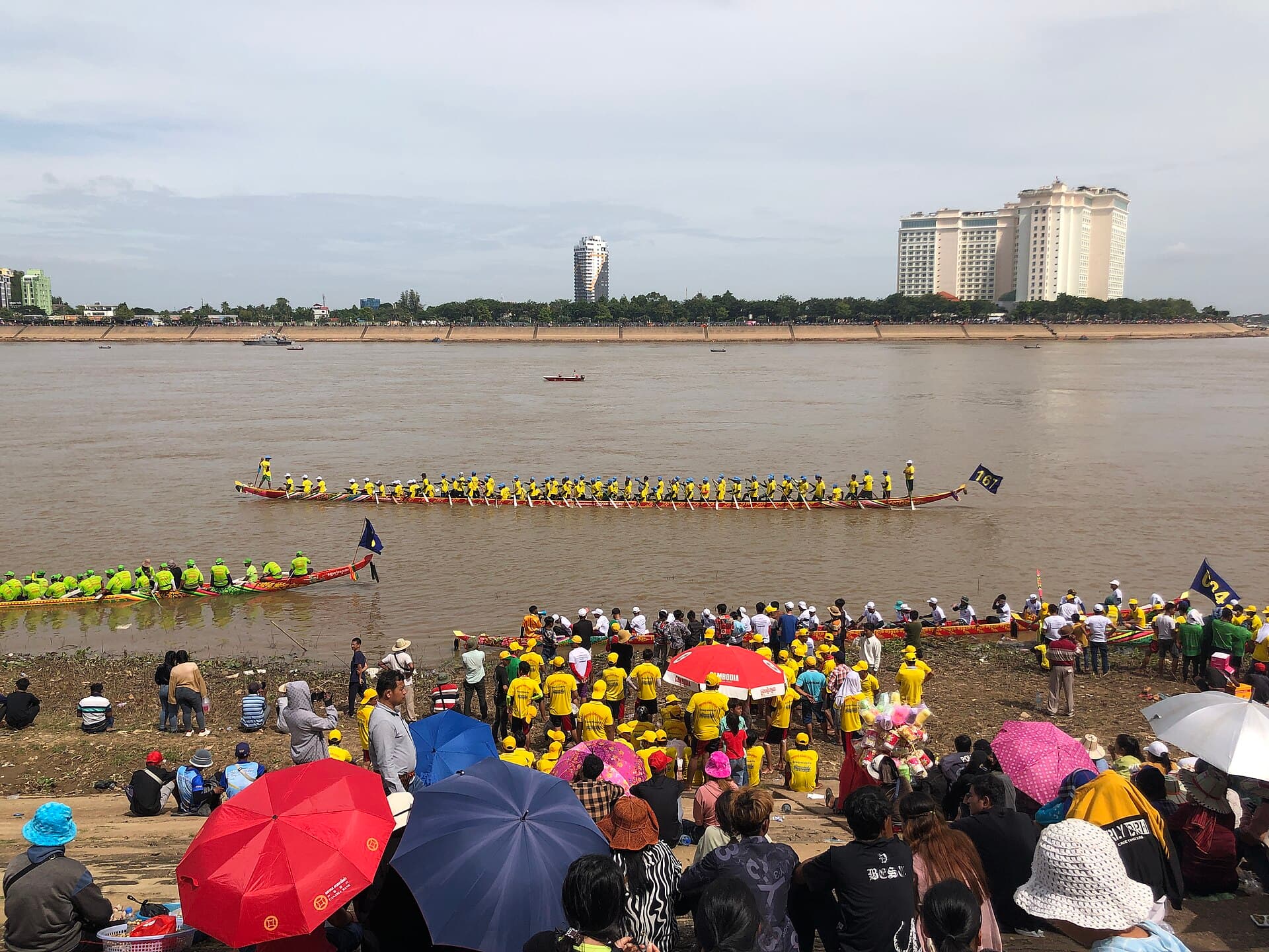 Long boats racing on the river at the Water Festival in Phnom Penh