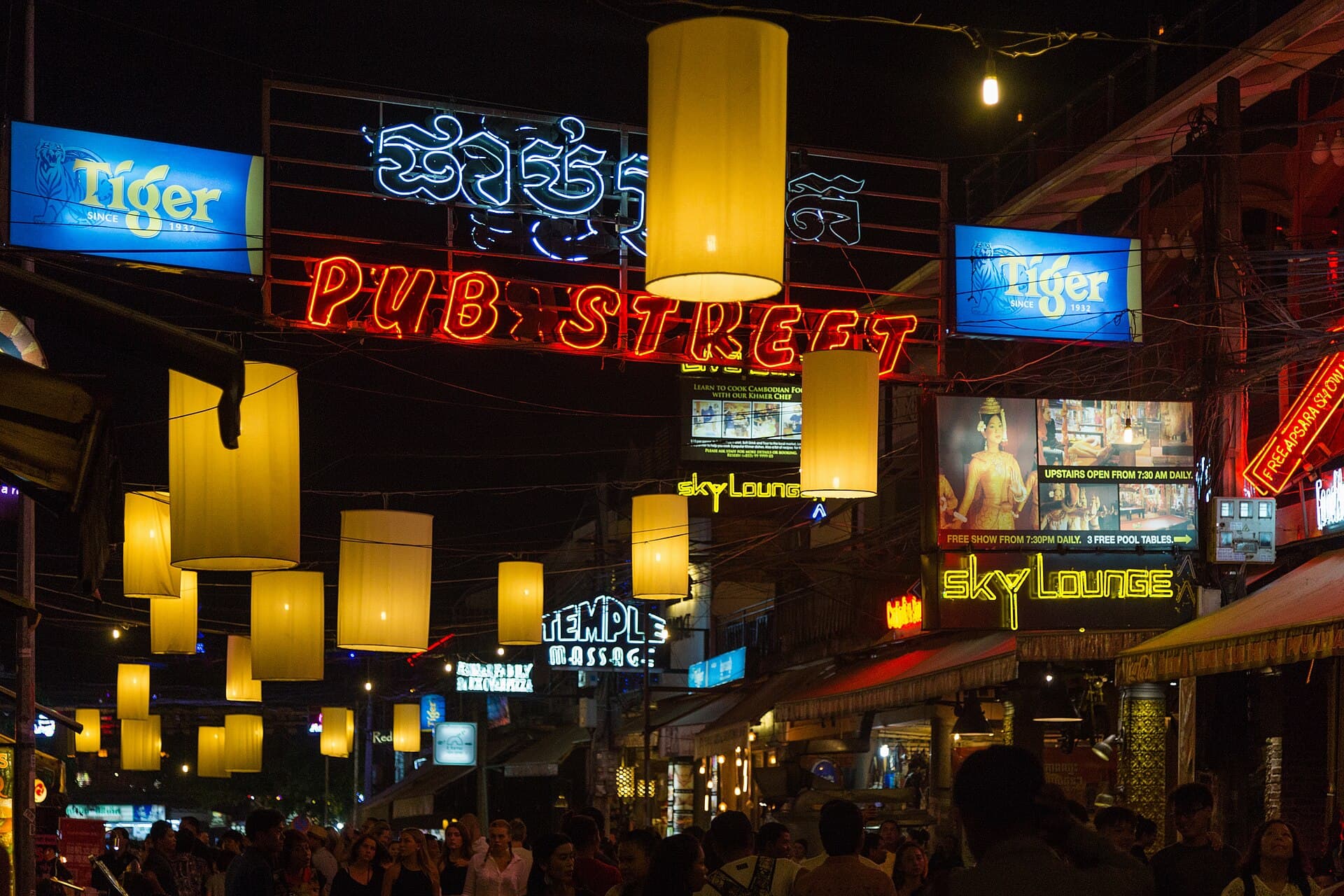 Neon signs and lanterns on Pub Street at night, Siem Reap