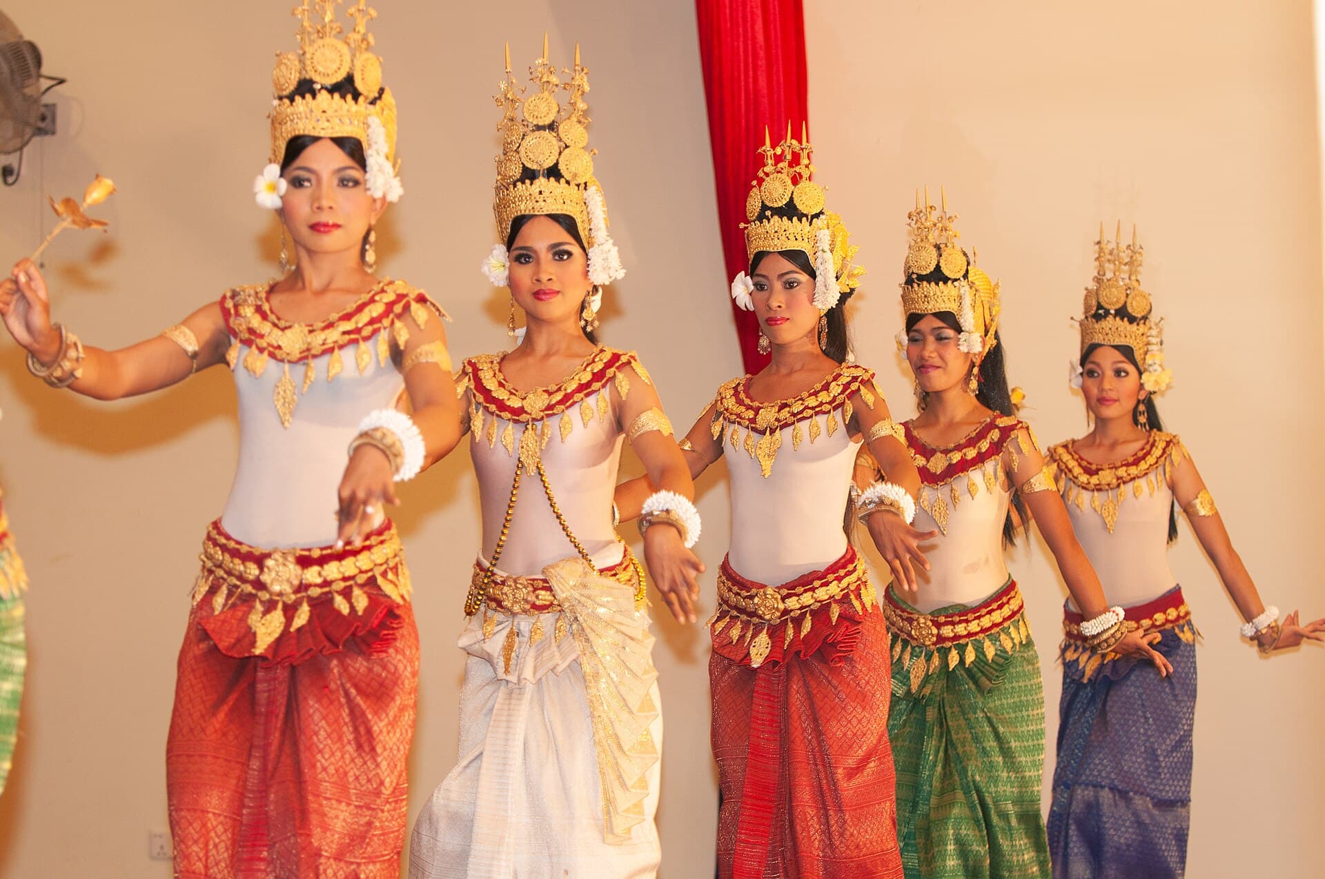 Apsara dancers in gold headdresses and costumes