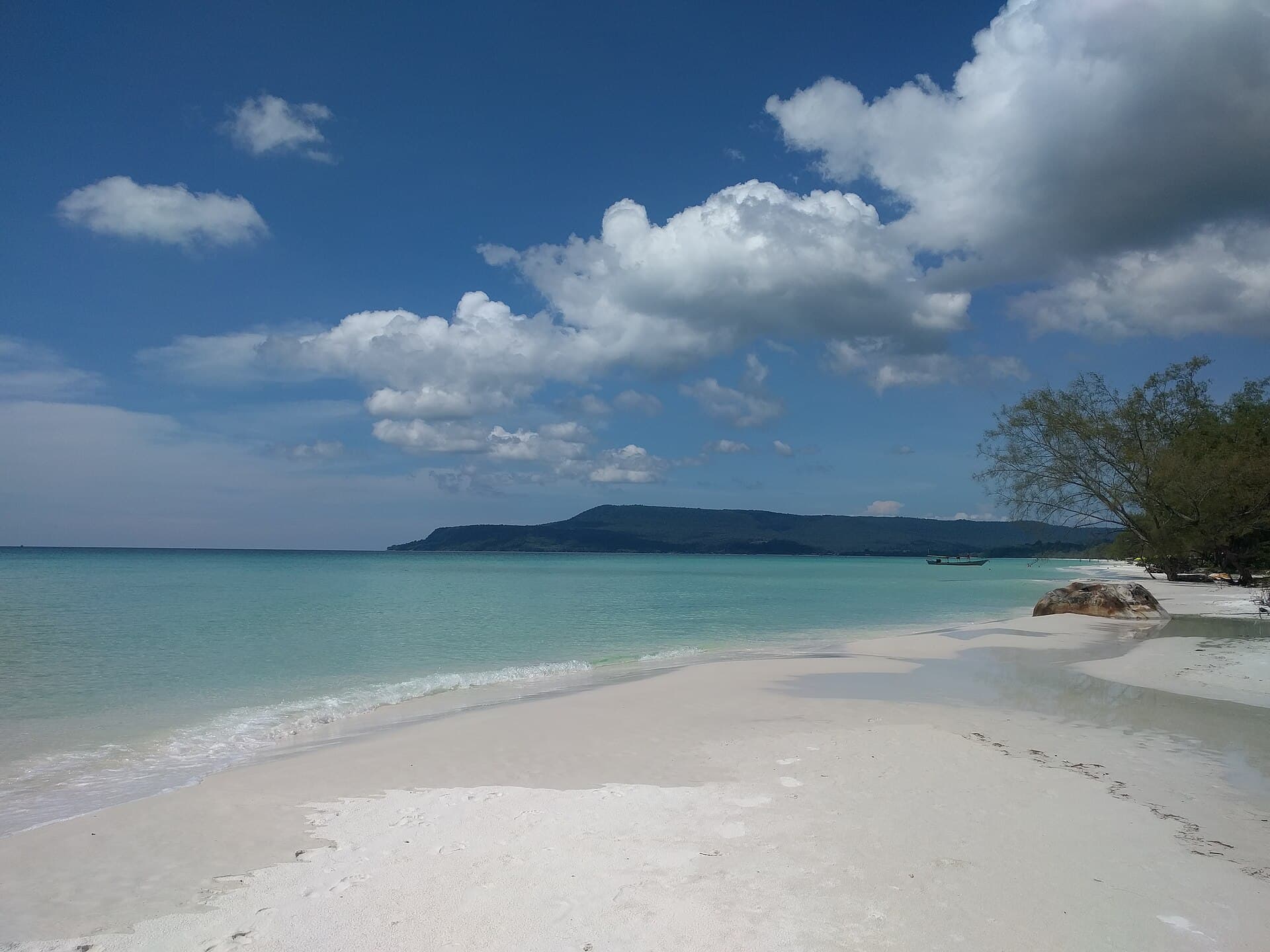 An empty white-sand beach and turquoise water on Koh Rong